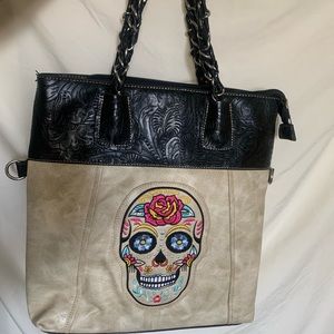 Perfect condition candy skull leather bag